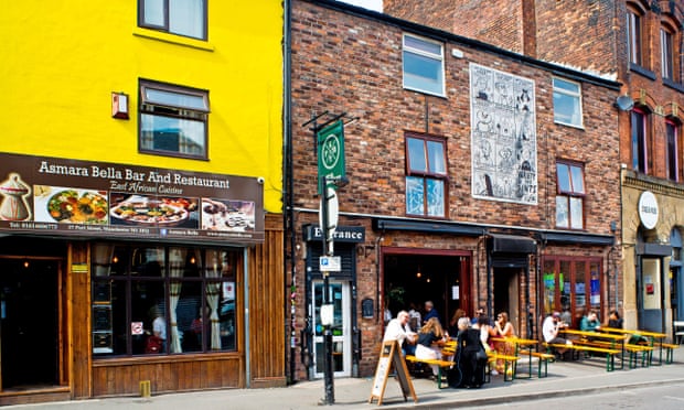 Asmara Bella Bar and Restaurant, Manchester, with people eating and drinking outside