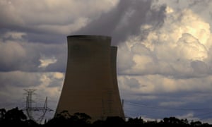 clouds behind a chimney of a coal-powered power station