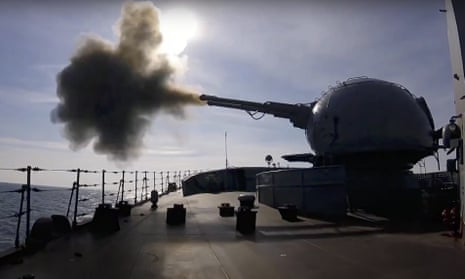 A cannon mounted on a Russian war ship fires during a naval exercise in the Black Sea, as seen in a still taken from video provided by the Russian Defense Ministry Press Service on 18 February. 