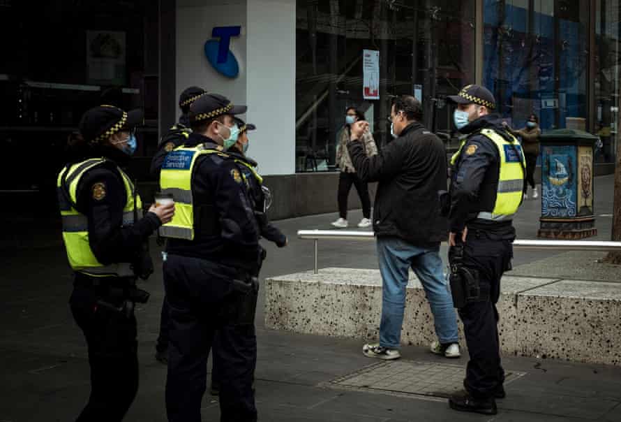 In Bourke Street police are seen enforcing mask wearing protocol.
