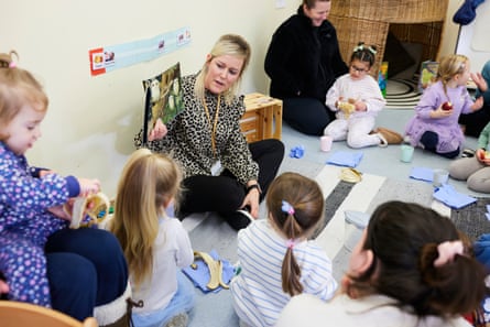 Children and their parents taking part in activities at a local centre