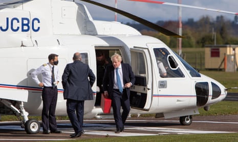 Boris Johnson steps off a helicopter at Wolverhampton Halfpenny Green airport