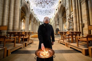 Head verger, Charlie Brown, burns palm crosses from last year’s Palm Sunday in the nave of Ripon Cathedral, in Yorkshire, England. The ash will be sprinkled on worshipers as a token of penitence
