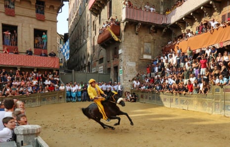 A horse running for the Contrade Aquila during a trial race, or Prove, a couple of days before the historical Palio di Siena at the Piazza del Campo.