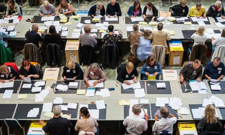 Election helpers count votes in Stockholm on 14 September 2022.