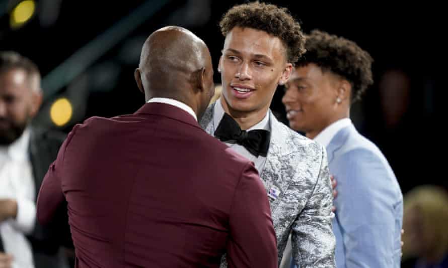Dyson Daniels is congratulated by family and friends after being selected eighth overall by the New Orleans Pelicans