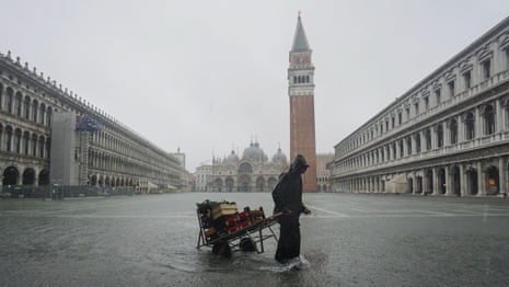 Venice: St Mark's Square deluged by flood water – video