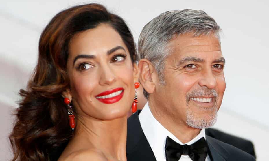 George and Amal Clooney, whose organization has provided financial assistance to combat extremism.