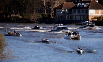 Cambridge men's team rowers approach the finish line in the Oxford-Cambridge Boat Race, 30 March 2024.
