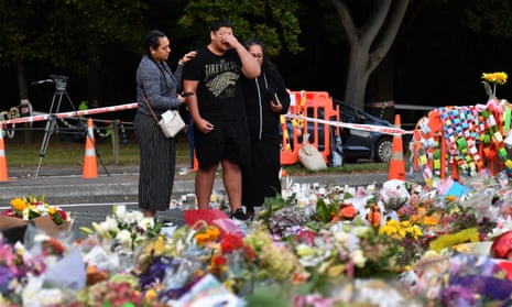 Members of the the public grieve at a makeshift memorial in Christchurch after the massacre in which 51 people were shot dead. Brenton Tarrant, the murderer, used the sonnerad in his manifesto.