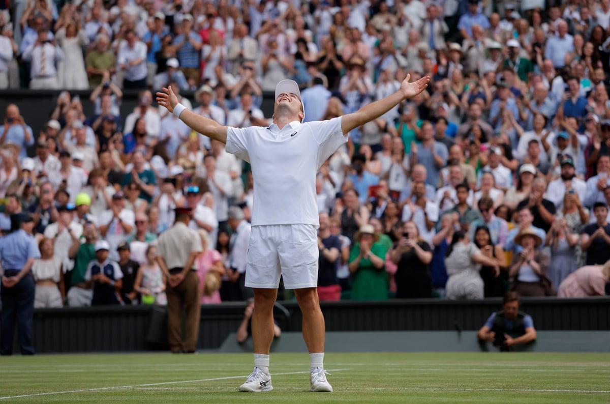 Arthur Fery stretches his arm in celebration after victory over Grigor Dimitrov in five sets on Centre Court during Wimbledon 2026