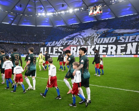 The Hamburg and Werder Bremen players absorb the pre-match atmosphere at the Volksparkstadion.
