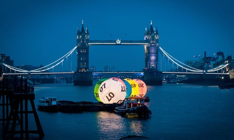 UK National Lottery Balls on the River Thames in front of Tower Bridge,