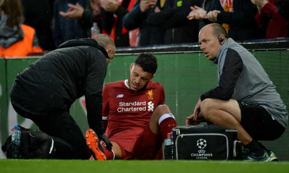 Alex Oxlade-Chamberlain shows his despair after picking up an injury during the Champions League tie betweeen Liverpool and Roma on 24 April.