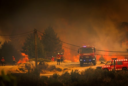 Firefighters and fire trucks tackle a huge blaze