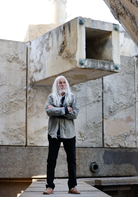 a man in front of a fountain