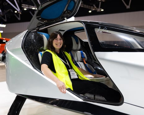 Caitlin Cassidy sits in the XPeng eVTOL ‘flying car’ at the EV Motor Show in Sydney.