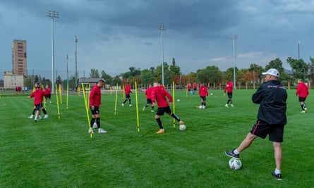 Yuriy Vernydub watches his Kryvbas players during a training session in August 2022