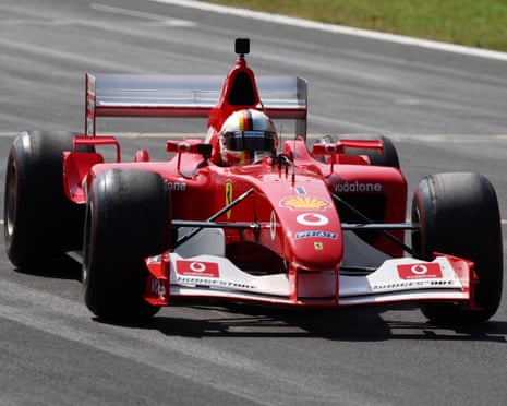 Sebastian Vettel drives the F2002 during his lap of honour for Michael Schumacher.