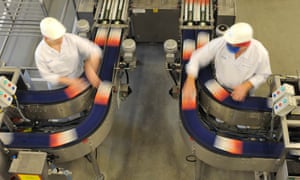 Employees work on the Uncle Ben's production line