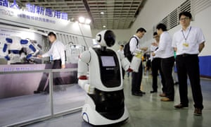 People view a robot during the Taiwan Automation Intelligence and Robot Show in Taipei, Taiwan, in August
