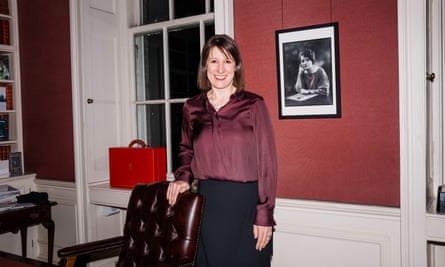 Rachel Reeves standing in her office with her hand on a leather chair