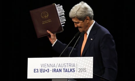 John Kerry, US secretary of state, holds up the Iran nuclear agreement at a press conference in Vienna. 
