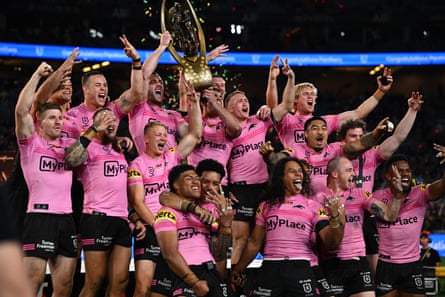Penrith players with the Provan-Summons Trophy after winning the 2024 NRL grand final.