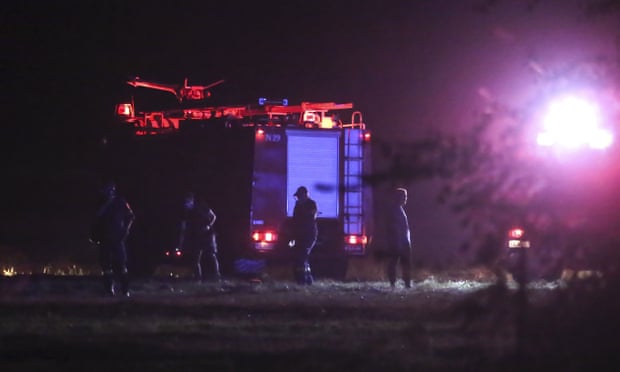 Firefighters are seen near the site of the crash, a few miles away from the city of Kavala.