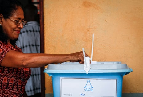 A woman casts her vote during the presidential election at a polling station in Dili, Timor-Leste, on Monday.