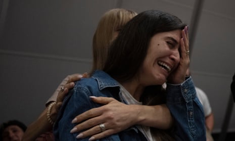 A relative of an Israeli missing since a surprise attack by Hamas militants near the Gaza border, is overcome by emotion during a press conference in Ramat Gan, Israel, on Sunday.