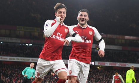Mesut Özil and Sead Kolasinac celebrate Özil’s goal, the third Arsenal scored in the space of four second-half minutes at the Emirates Stadium.