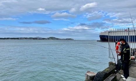 A fisherman at Auckland’s harbour on election day 2023.