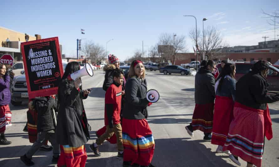 People participate in a march in downtown Rapid City, South Dakota, 14 February 2019, to call attention to missing and murdered Native American women and girls.