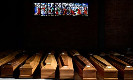 Coffins of people who have died from coronavirus disease (COVID-19) are seen on 23 March in the church of the Serravalle Scrivia cemetery, which like many places in northern Italy is struggling to cope with the number of deaths. 