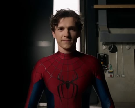 man smiling in spiderman suit