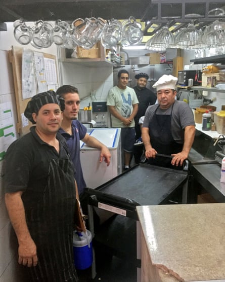 Sergio Cano, the head chef (far left), with the rest of his owner-workers in the kitchen at Ale Ale.