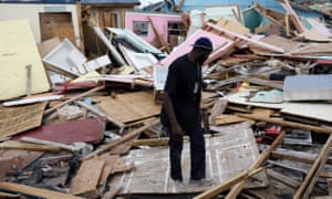 A man looks for valuables things among the debris at The Mud neightborhood.