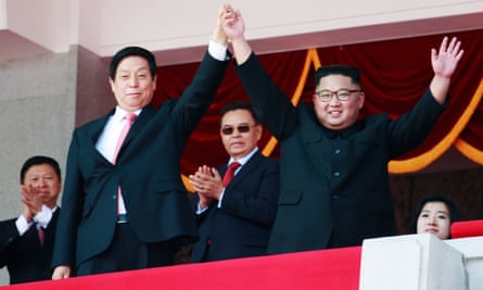 Kim Jong-un and Li Zhanshu, China’s third highest ranking official, wave to the crowd during a parade celebrating the 70th anniversary of North Korea’s foundation.