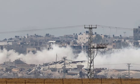 Smoke rises from destroyed buildings lying in ruin in the Gaza Strip, amid the ongoing conflict between Israel and the Palestinian Islamist group Hamas, as seen from southern Israel on Thursday.