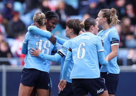 Bunny Shaw celebrates with teammates