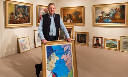 Philip Bacon holds a Barry Humphries painting (Double Self Portrait ‘04). Brisbane art dealer Philip Bacon is the executor of both Margaret Olley and Barry Humphries. The three were close friends for decades. Bacon is Margaret Olley retrospective for what would have been her 100th birthday.