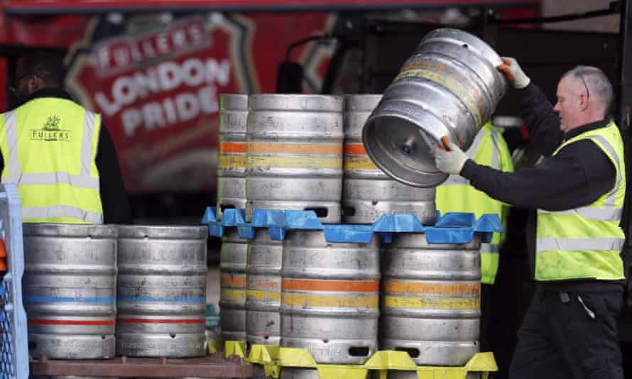 A Fullers brewery employee lifting a barrel. Japanese brewer Asahi bought Fuller Smith &amp; Turner’s for £250m this year.