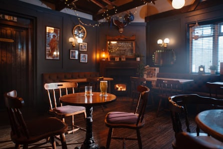 Empty but cosy-looking pub with drinks on table