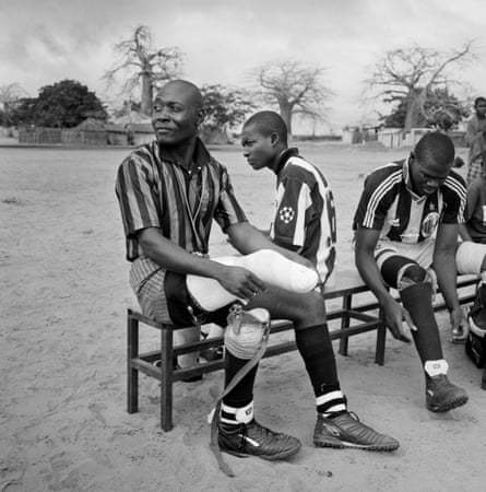 Fighting spirit ... war veterans pull on false limbs for a football match in Angola.