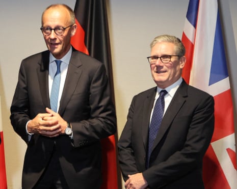 Germany's chancellor Friedrich Merz and Britain's prime minister Keir Starmer pose as they meet on the sidelines of the two-day Nato's Heads of State and Government summit in The Hague.