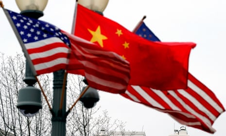 A lamp post outside the White House is adorned with Chinese and US national flags in Washington.