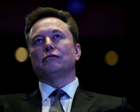 man wearing black suit looks up