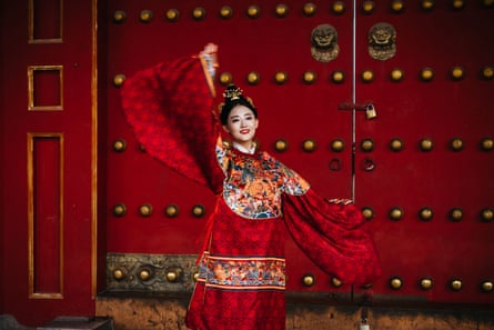 A women performs at the Forbidden City.