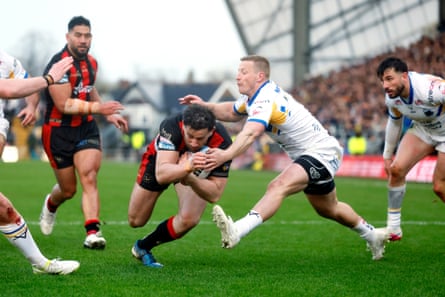 Warrington's Toby King breaks through to score a try against Leeds.
